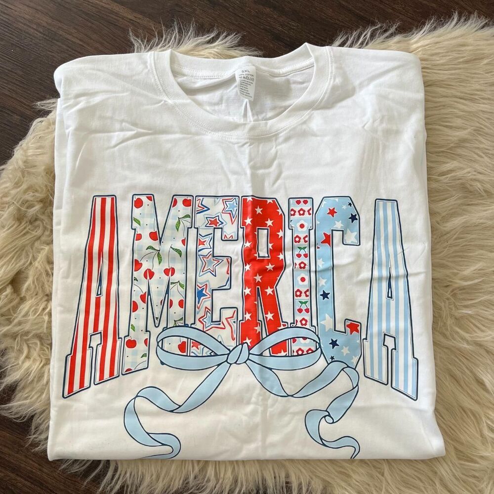 NWOT White Plus Size "America" Bow Red White & Blue Patriotic Graphic T-shirt